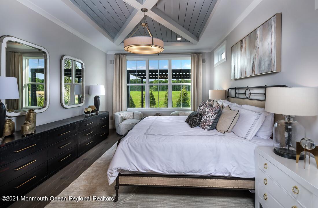 108 Sofia Drive Manalapan, NJ 07726 - Photo 6 of 9 a bedroom with a large bed and a large window with outer view