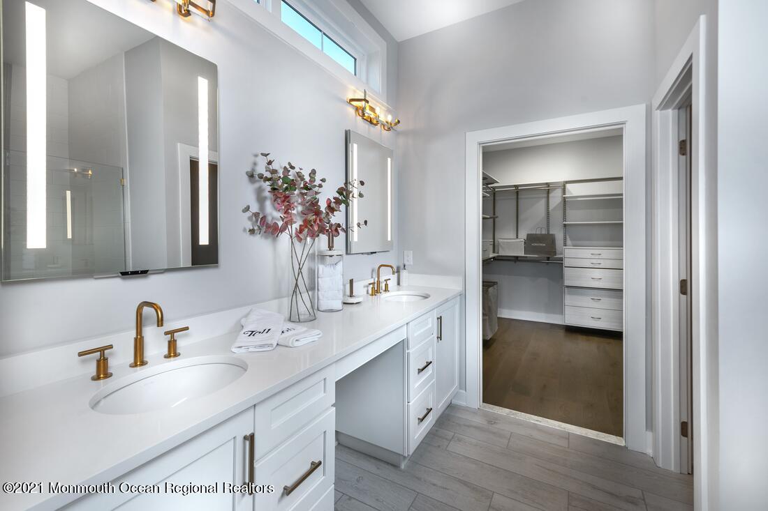 108 Sofia Drive Manalapan, NJ 07726 - Photo 7 of 9 a bathroom with a sink and a mirror