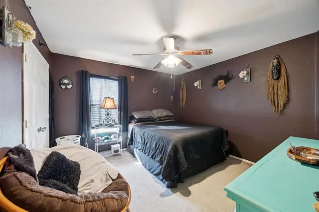 a bathroom with a sink a toilet and shower curtain
