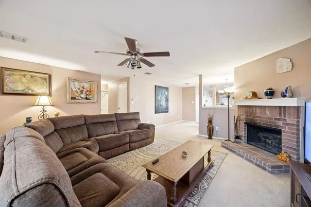a living room with furniture and fireplace