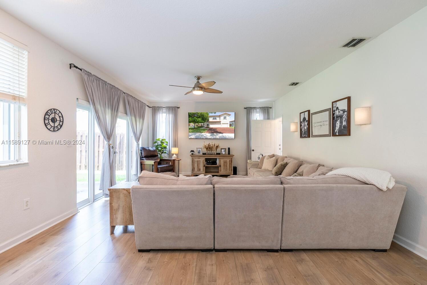 2000 Northeast 40th Road Homestead, FL 33033 - Photo 13 of 33 a living room with furniture and a large window
