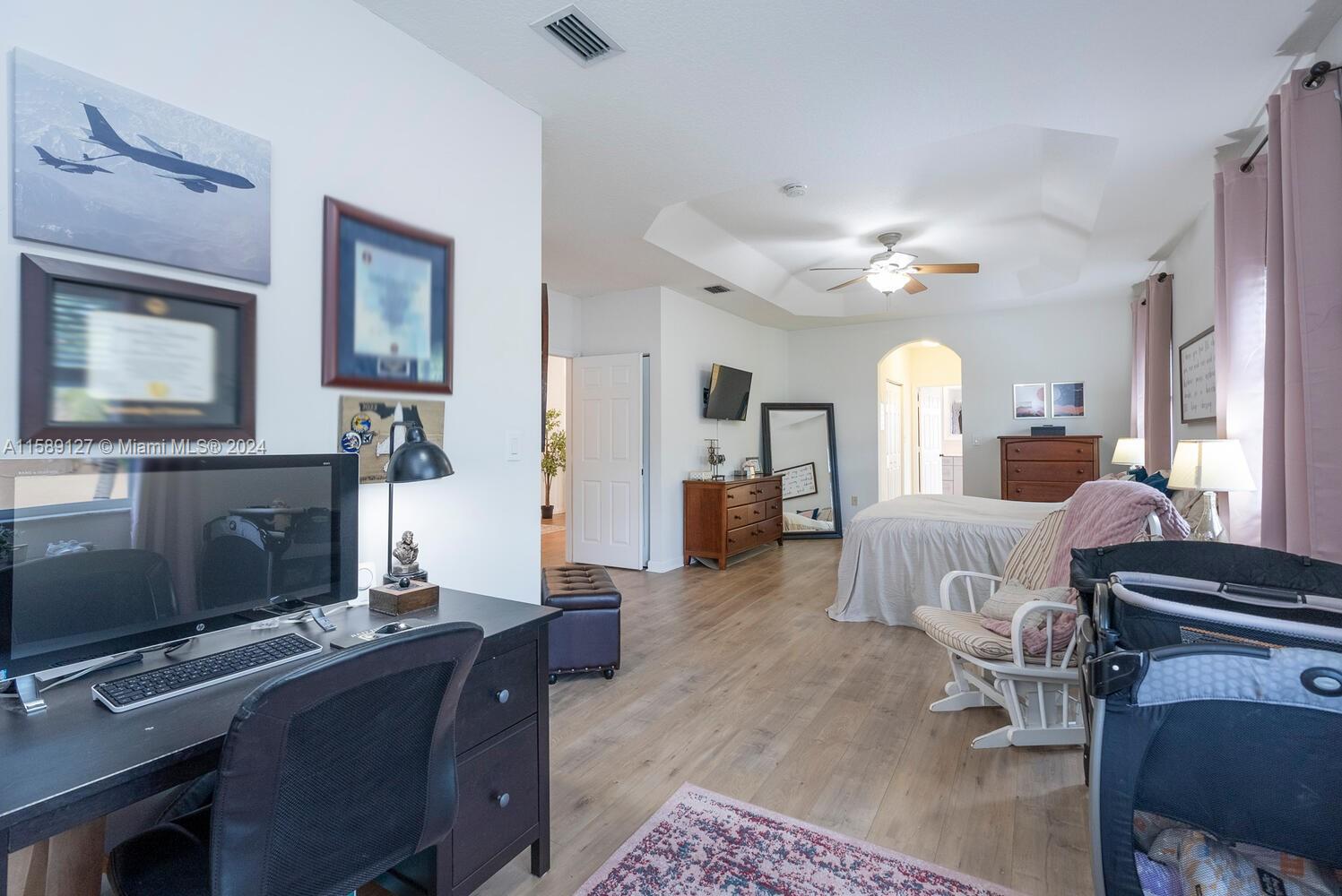 2000 Northeast 40th Road Homestead, FL 33033 - Photo 22 of 33 a living room with furniture a fireplace and a flat screen tv