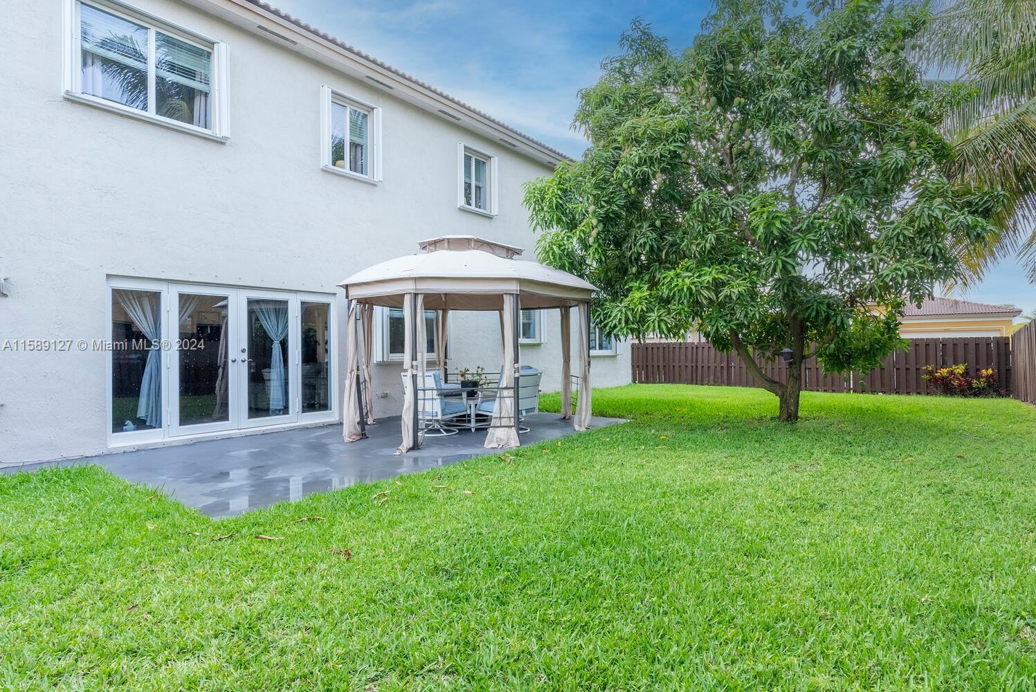 2000 Northeast 40th Road Homestead, FL 33033 - Photo 31 of 33 a view of a house with a yard and sitting area
