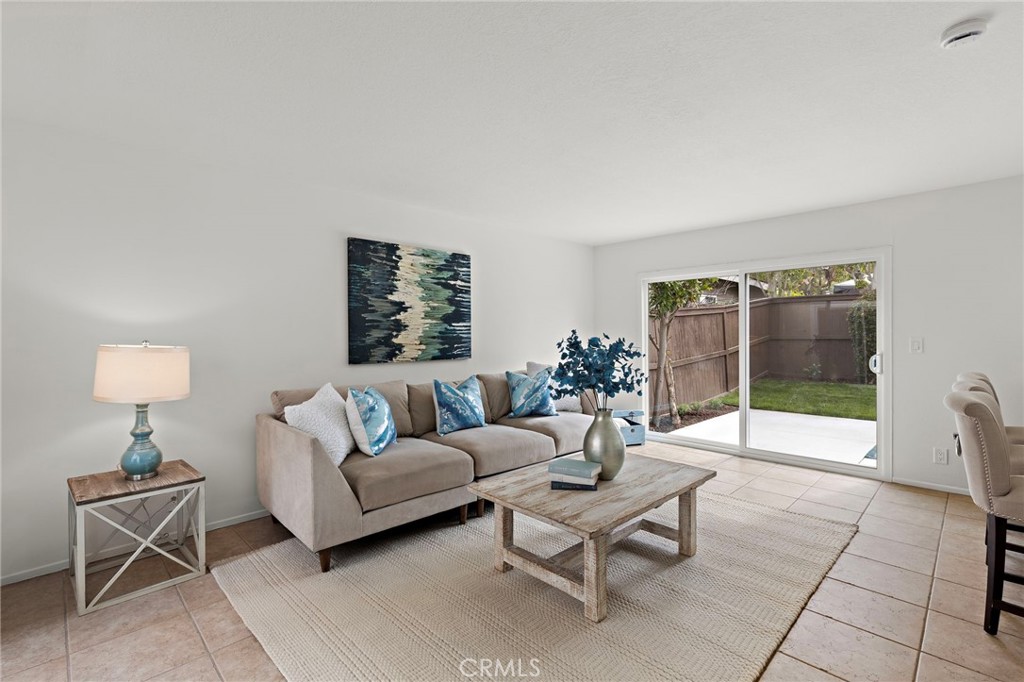 8 Caraway Irvine, CA 92604 - Photo 13 of 33 a living room with furniture and a lamp