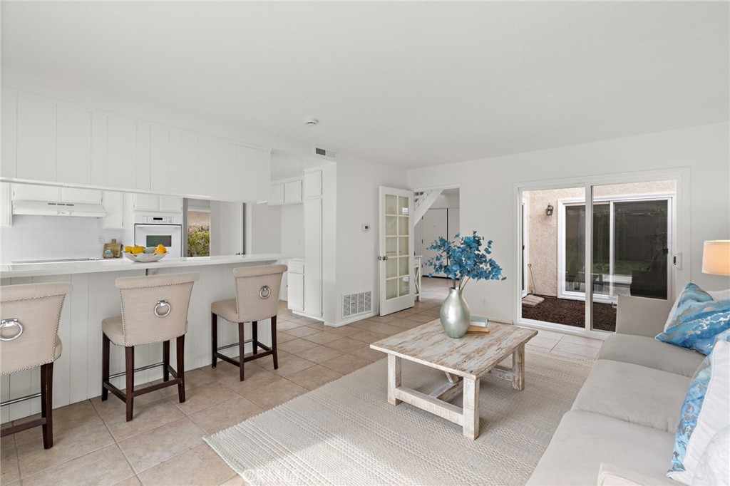 8 Caraway Irvine, CA 92604 - Photo 15 of 33 a living room with furniture and wooden floor