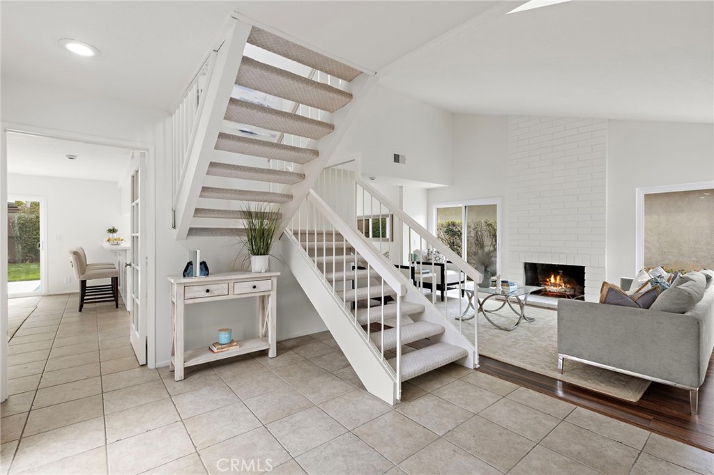 8 Caraway Irvine, CA 92604 - Photo 17 of 33 a living room with furniture and a chandelier