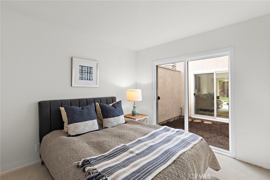 8 Caraway Irvine, CA 92604 - Photo 18 of 33 a bedroom with a bed and a large mirror