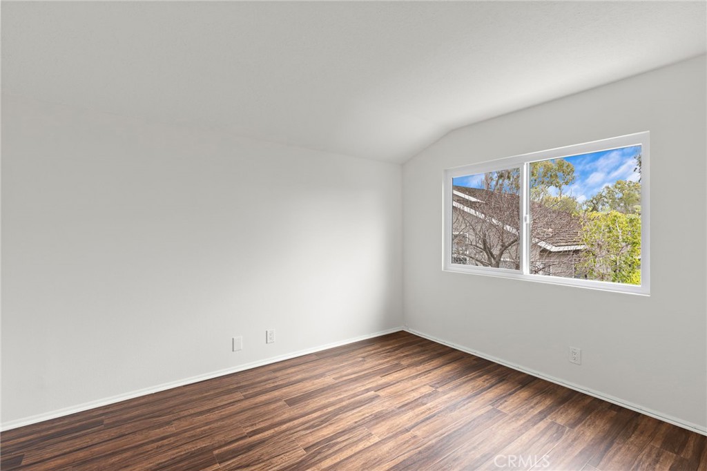 8 Caraway Irvine, CA 92604 - Photo 20 of 33 an empty room with wooden floor and window