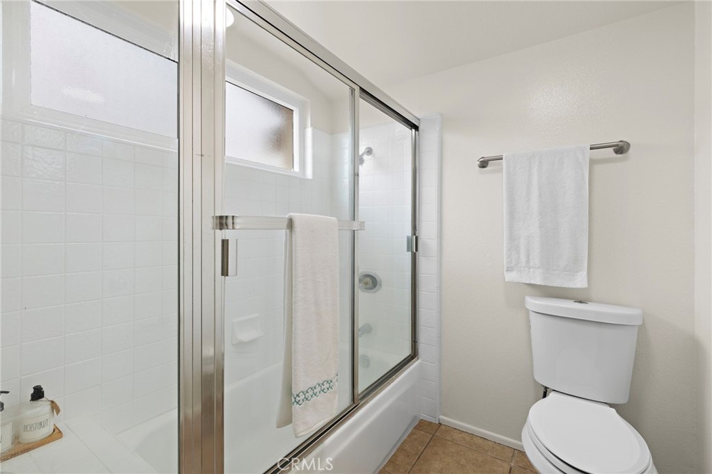 8 Caraway Irvine, CA 92604 - Photo 26 of 33 a white toilet sitting next to a bathroom sink