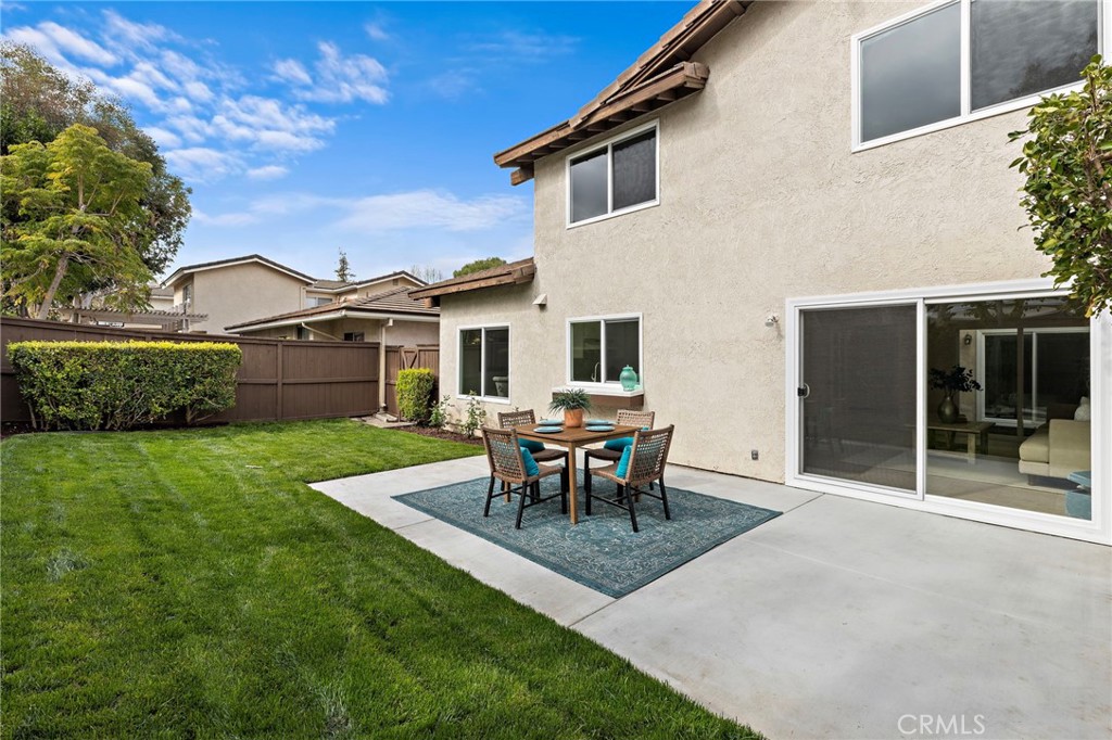 8 Caraway Irvine, CA 92604 - Photo 28 of 33 a patio with table and chairs