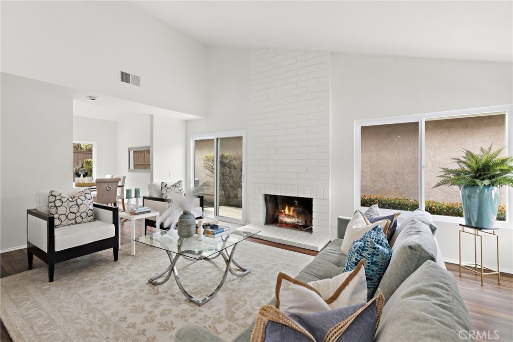 8 Caraway Irvine, CA 92604 - Photo 5 of 33 a living room with furniture and a fireplace