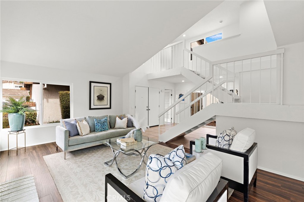 8 Caraway Irvine, CA 92604 - Photo 6 of 33 a living room with furniture and wooden floor