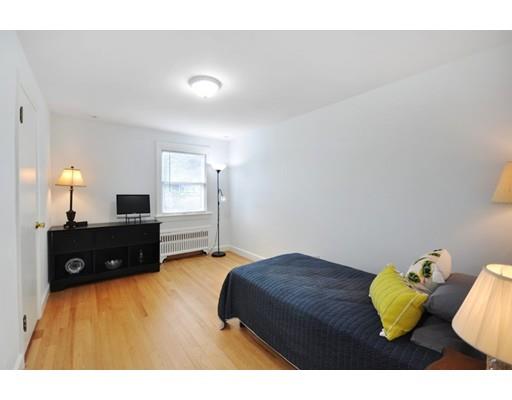16 Wadsworth Road Arlington, MA 02476 - Photo 20 of 35 a bedroom with a bed and a lamp