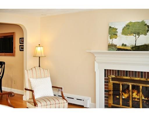16 Wadsworth Road Arlington, MA 02476 - Photo 27 of 35 a picture of a living room with a fireplace and a flat screen tv