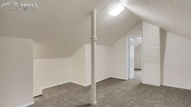 a room with furniture and gym equipment