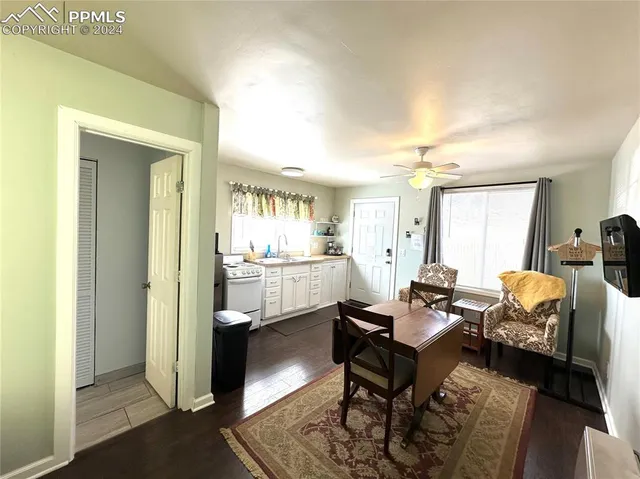a kitchen with a sink appliances and cabinets