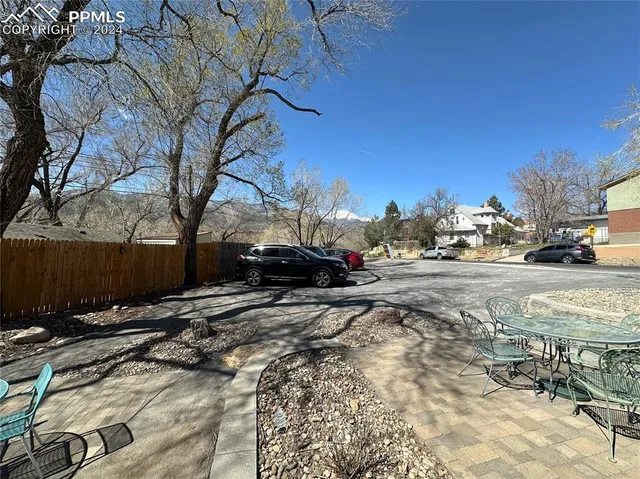 a view of street with parked cars