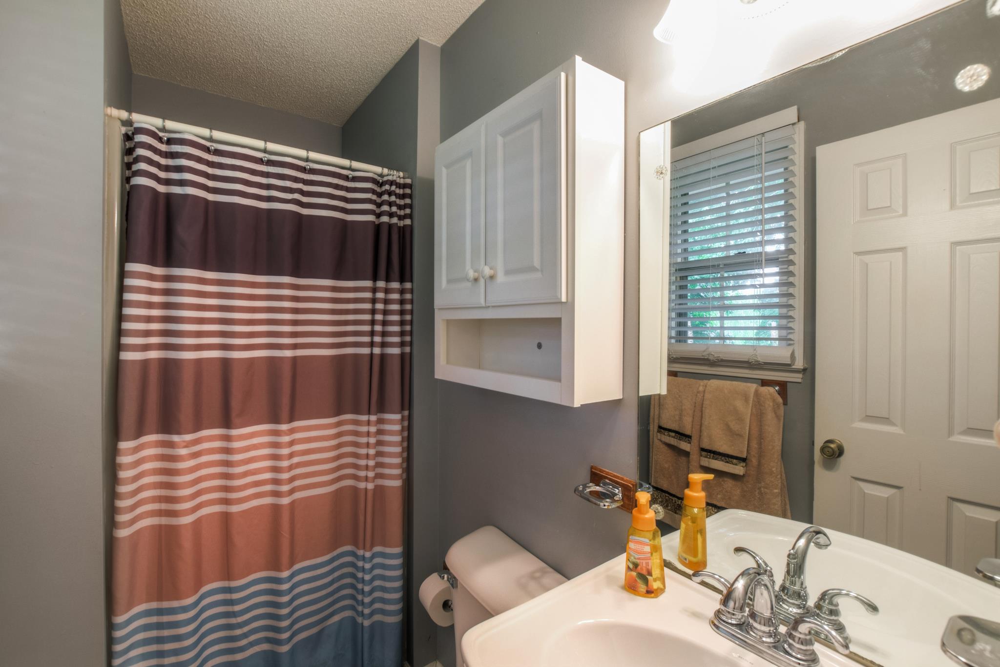 2860 South Rutland Road Mount Juliet, TN 37122 - Photo 11 of 20 a bathroom with a sink and a mirror