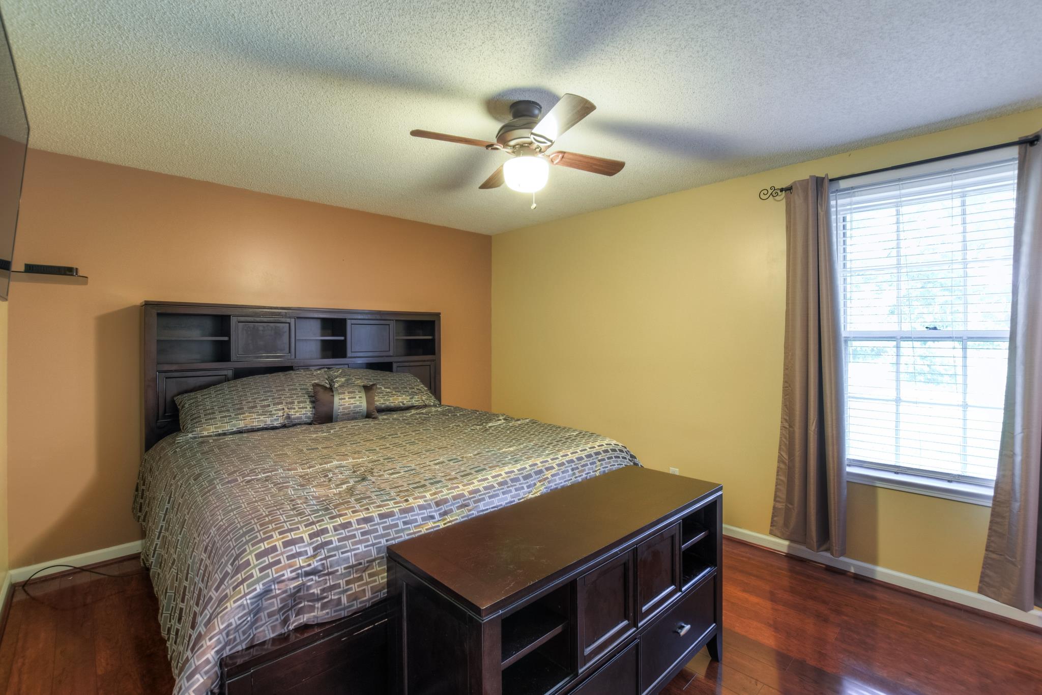 2860 South Rutland Road Mount Juliet, TN 37122 - Photo 12 of 20 a bed sitting in a room next to a window