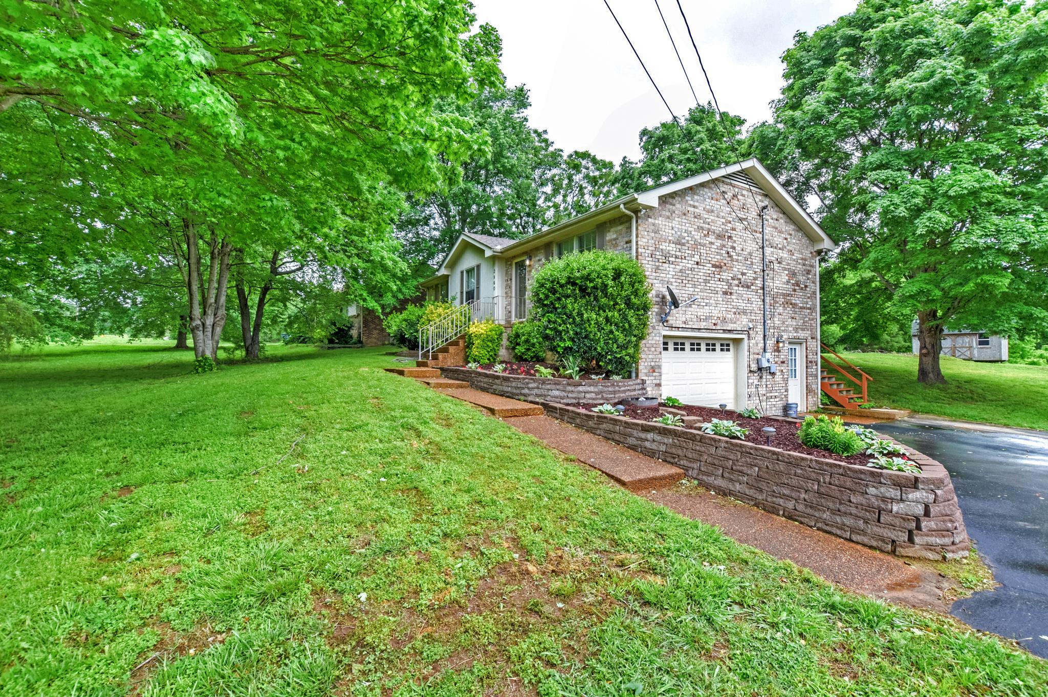 2860 South Rutland Road Mount Juliet, TN 37122 - Photo 2 of 20 a front view of a house with a yard