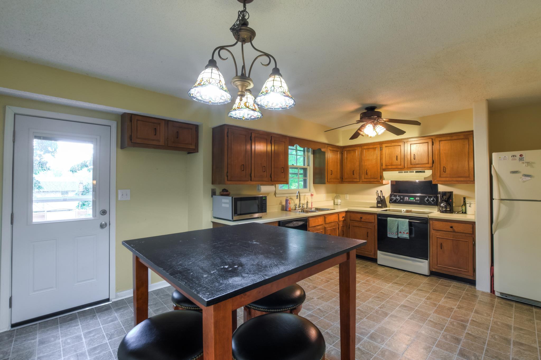 2860 South Rutland Road Mount Juliet, TN 37122 - Photo 7 of 20 a kitchen with stainless steel appliances granite countertop a sink a stove and refrigerator