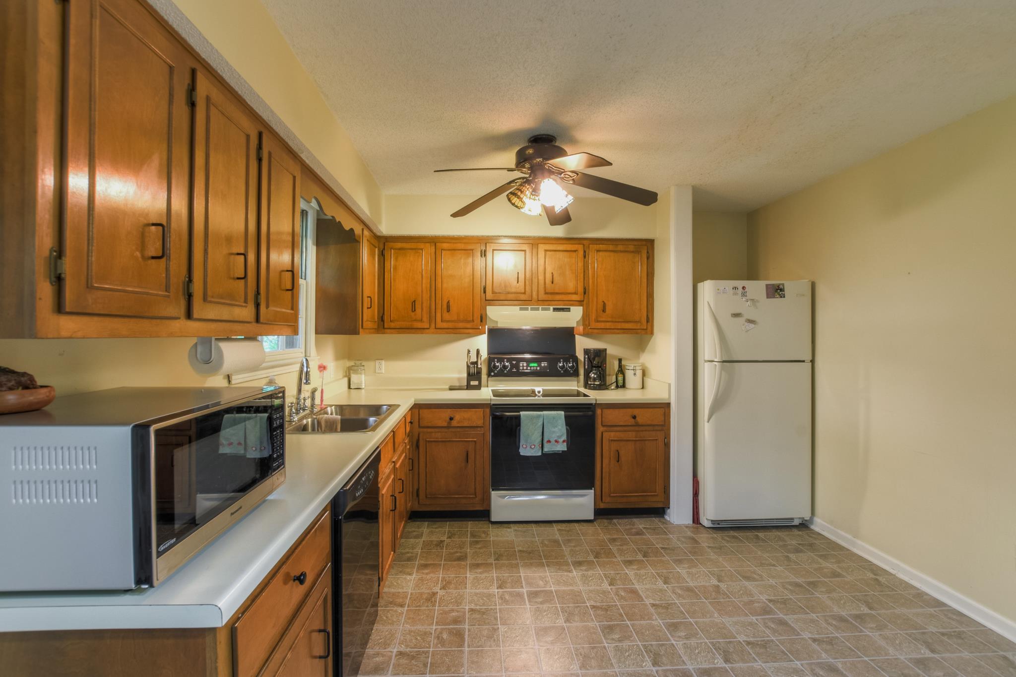 2860 South Rutland Road Mount Juliet, TN 37122 - Photo 9 of 20 a kitchen with stainless steel appliances granite countertop a stove a refrigerator and a sink