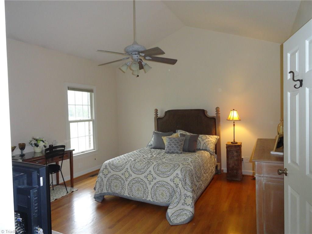 1122 Nance Road King, NC 27021 - Photo 10 of 30 Main level master features cathedral ceilings and gas fireplace
