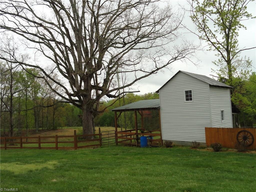 1122 Nance Road King, NC 27021 - Photo 28 of 30 Workshop/storage barn with lean-to's also has water and electricity.