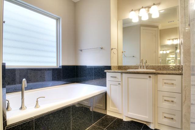 1138 Robbie Street Houston, TX 77009 - Photo 11 of 17 a bathroom with a sink and a mirror