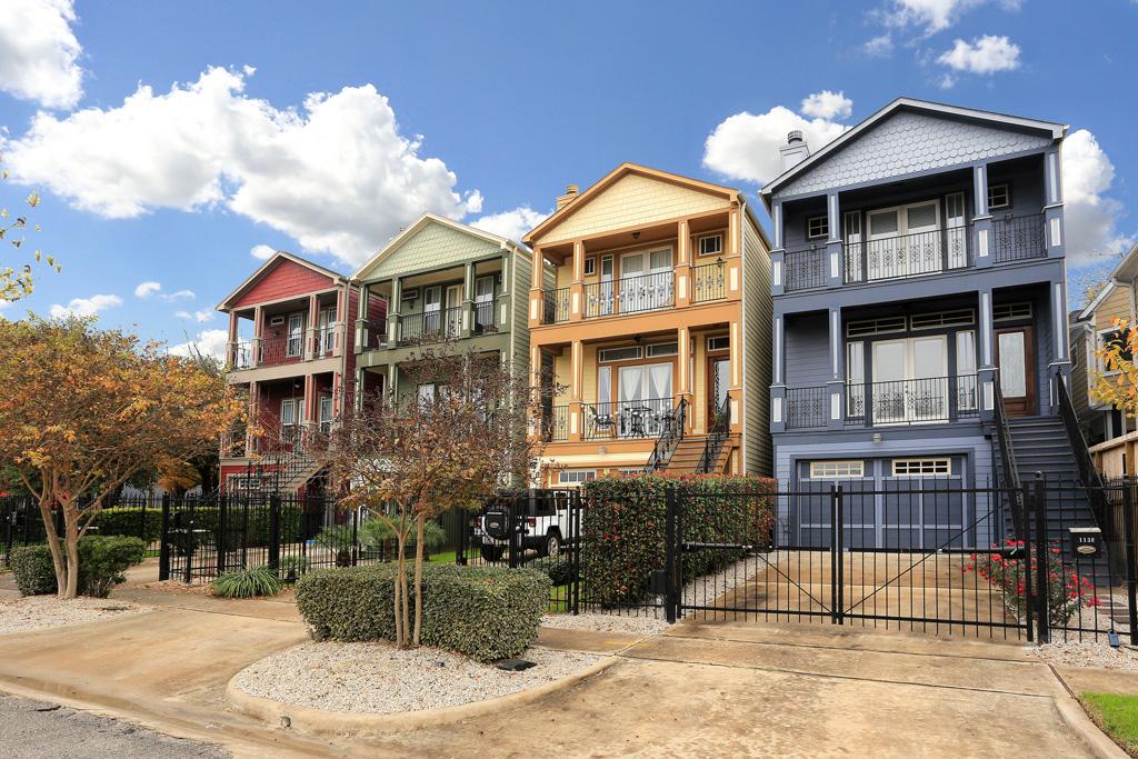 1138 Robbie Street Houston, TX 77009 - Photo 2 of 17 a view of a brick house with many windows next to a road