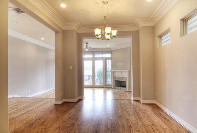 1138 Robbie Street Houston, TX 77009 - Photo 5 of 17 a view of a room with wooden floor and chandelier