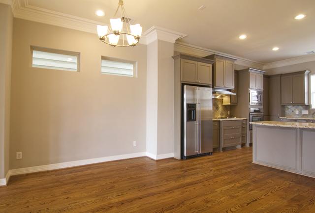 1138 Robbie Street Houston, TX 77009 - Photo 6 of 17 a view of a kitchen with a sink a refrigerator and window