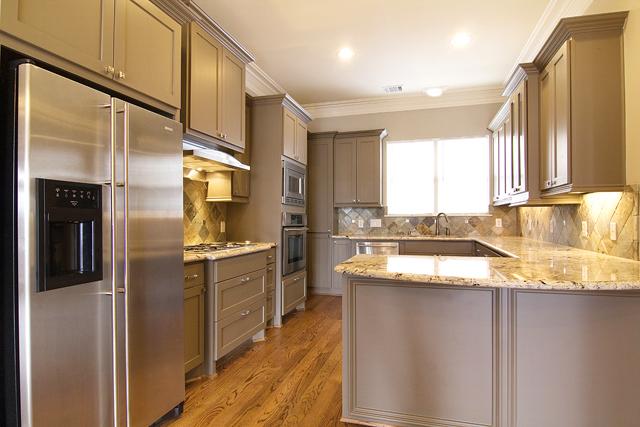 1138 Robbie Street Houston, TX 77009 - Photo 8 of 17 a kitchen with stainless steel appliances granite countertop a refrigerator a stove and a sink