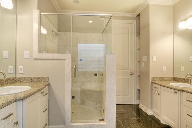 1138 Robbie Street Houston, TX 77009 - Photo 10 of 17 a bathroom with a granite countertop shower sink and mirror