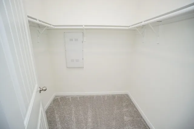 a view of a room with shelf on the wall