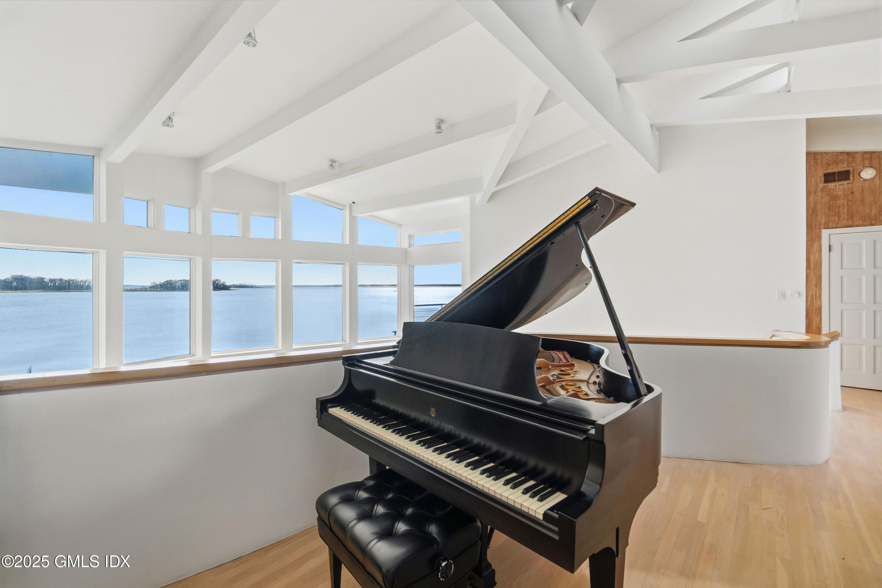 111 Byram Shore Road Greenwich, CT 06830 - Photo 12 of 23 a living room with furniture and a piano