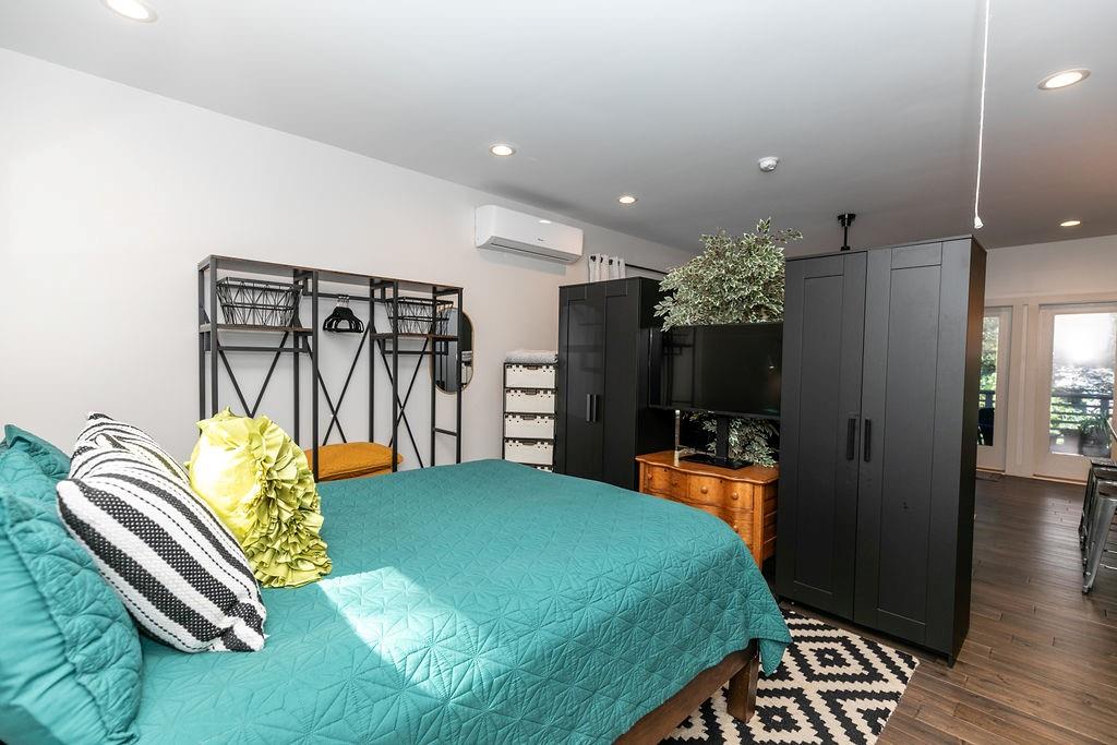 1084 Sanders Avenue Southeast, Unit B Atlanta, GA 30316 - Photo 14 of 28 a bedroom with a bed and a walk in closet