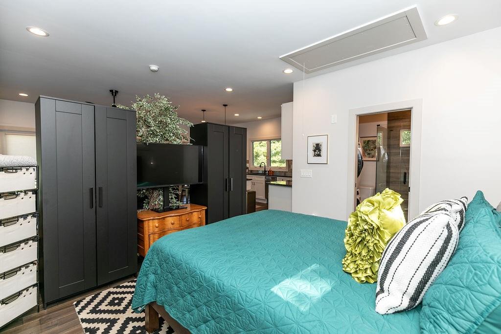 1084 Sanders Avenue Southeast, Unit B Atlanta, GA 30316 - Photo 15 of 28 a bed room with a bed mirror and a chair