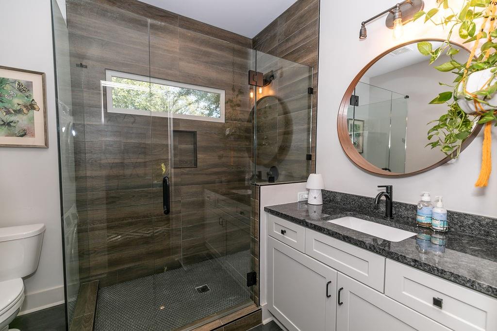 1084 Sanders Avenue Southeast, Unit B Atlanta, GA 30316 - Photo 17 of 28 a bathroom with a sink and a mirror