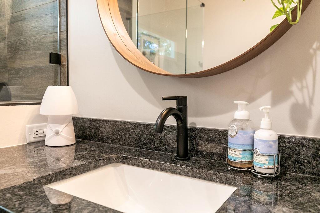 1084 Sanders Avenue Southeast, Unit B Atlanta, GA 30316 - Photo 20 of 28 a bathroom with a sink a toilet and a mirror
