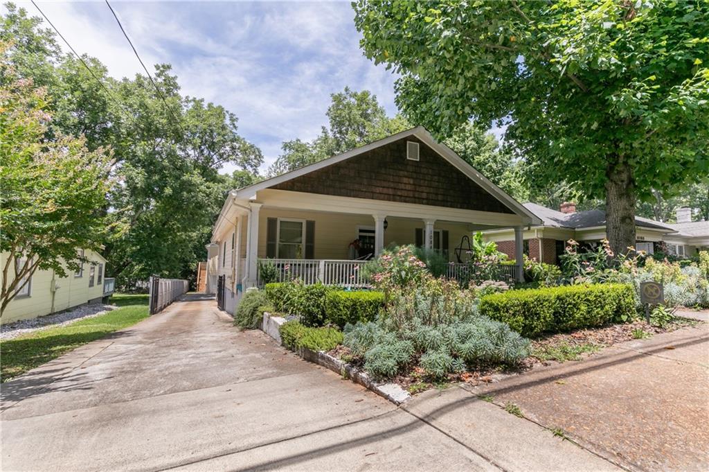 1084 Sanders Avenue Southeast, Unit B Atlanta, GA 30316 - Photo 24 of 28 a front view of a house with a yard