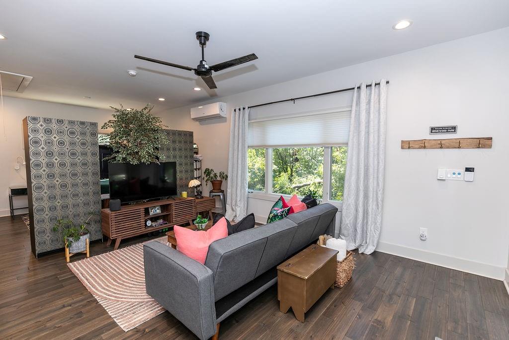 1084 Sanders Avenue Southeast, Unit B Atlanta, GA 30316 - Photo 4 of 28 a living room with furniture and a flat screen tv