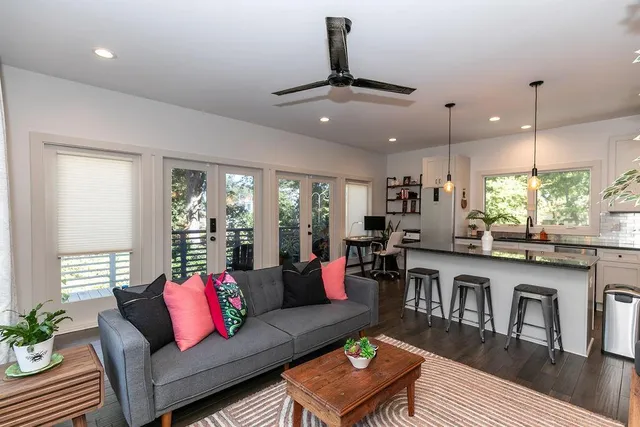 a living room with furniture and a large window