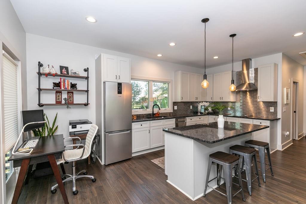 1084 Sanders Avenue Southeast, Unit B Atlanta, GA 30316 - Photo 7 of 28 a kitchen with stainless steel appliances granite countertop a sink a refrigerator and a stove