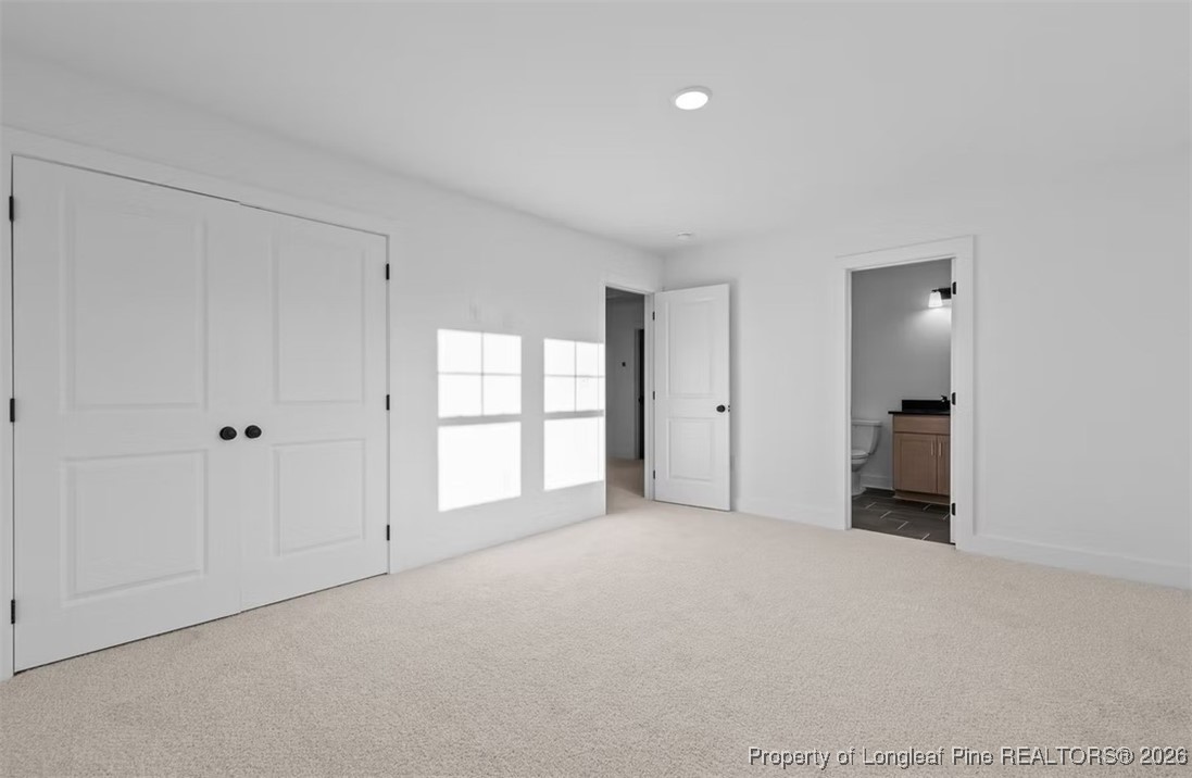 9844 Rockfish Road Raeford, NC 28376 - Photo 11 of 32 a view of an empty room with a window
