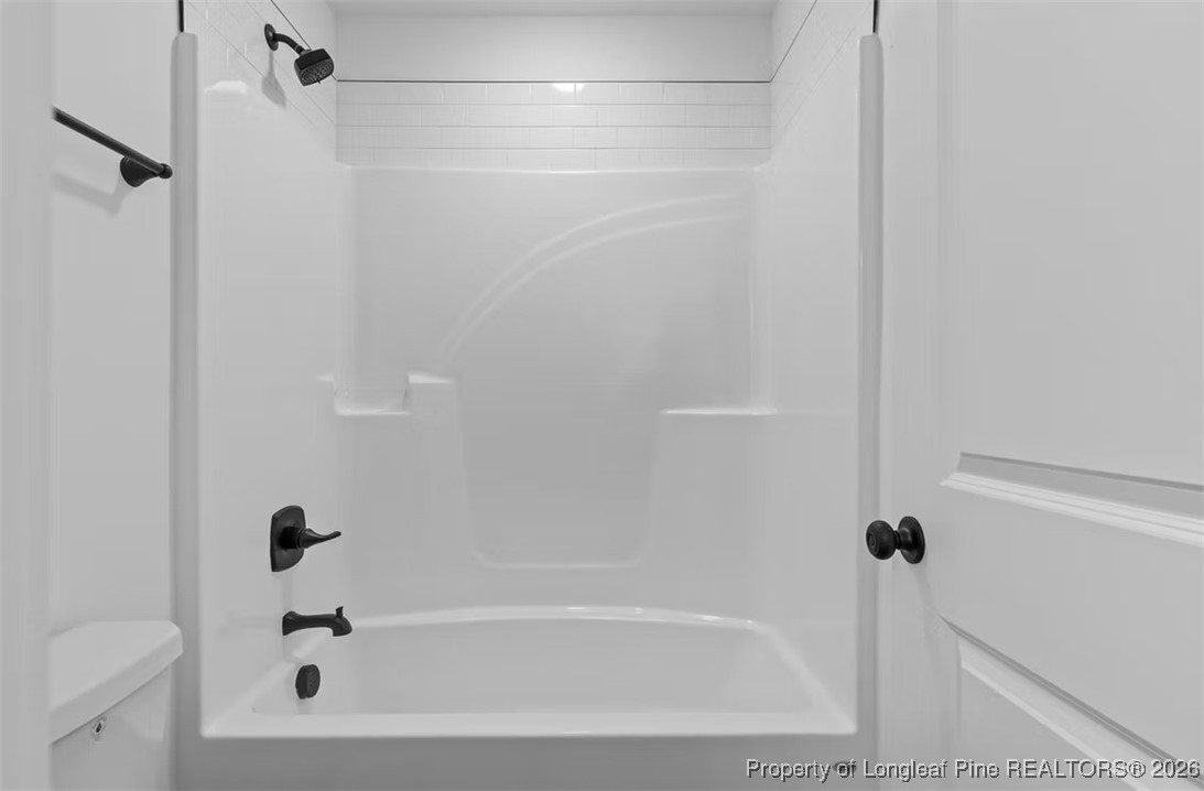 9844 Rockfish Road Raeford, NC 28376 - Photo 16 of 32 a bathroom with a bathtub