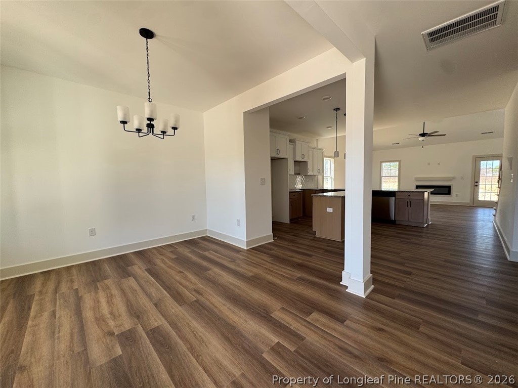 9844 Rockfish Road Raeford, NC 28376 - Photo 19 of 32 a view of empty room with wooden floor