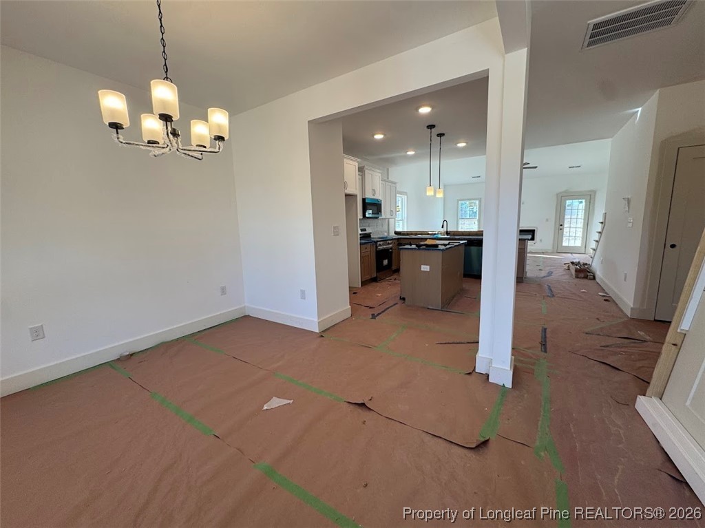 9844 Rockfish Road Raeford, NC 28376 - Photo 2 of 15 a view of a kitchen with granite countertop a refrigerator
