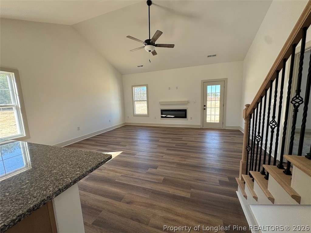 9844 Rockfish Road Raeford, NC 28376 - Photo 22 of 32 a view of an empty room with a fireplace and a window