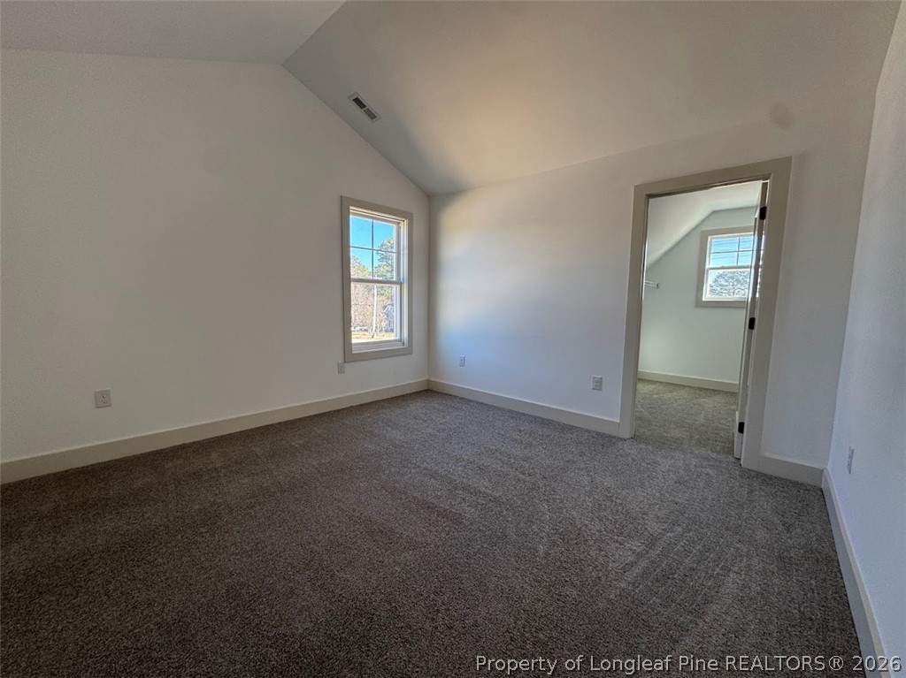 9844 Rockfish Road Raeford, NC 28376 - Photo 28 of 32 an empty room with windows and closet
